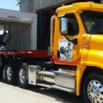 Freightliner Cascadia, transporting a white container