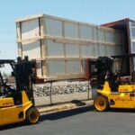 hyster forklift lifting large wooden crate